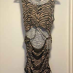 Super cuter summer look. Wear as dress or shirt. Perfect cut outs !